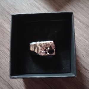 Silver ring not sure on the size it's smaller I would say size 6